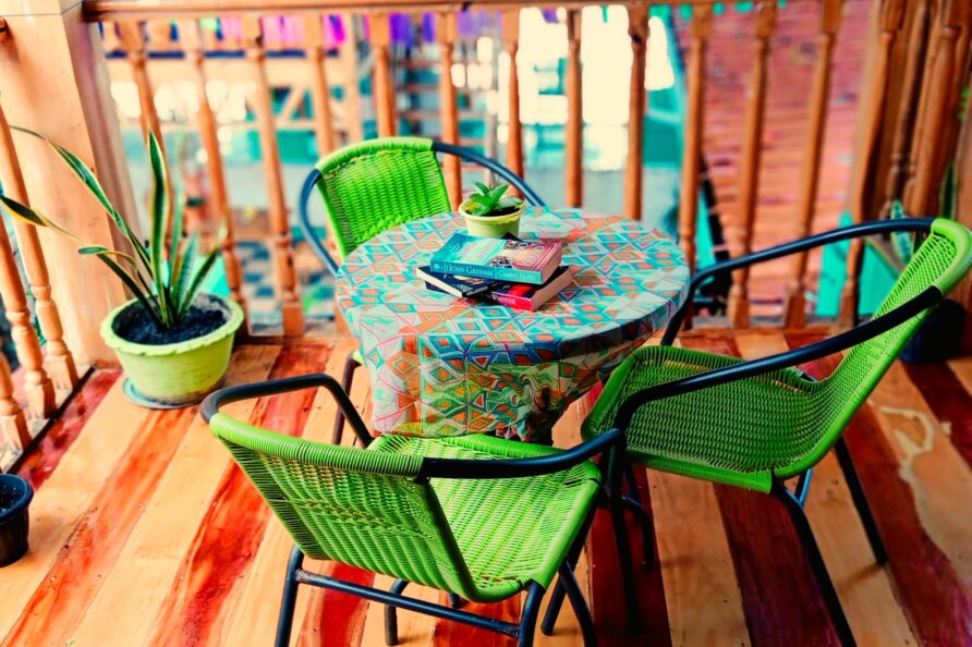 Private balcony view with colorful table for four at the VIP Executive Suite San Carlos resort.