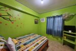 Main image of the Couples Room San Carlos, featuring the comfortable, larger bed and private air conditioning.