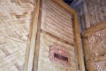 Unique entrance to the Affordable Treehouse Room San Carlos, showing the nipa door at the top of the stairs with a welcome sign.