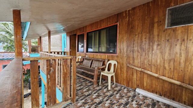 Large private balcony with woodgrain finishes in Family Cottage large group accommodation