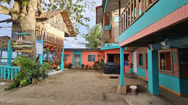 Colorful courtyard space for corn hole and games at large group family reunion venue