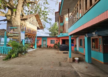 Colorful courtyard space for corn hole and games at large group family reunion venue