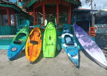 Colorful kayaks waiting for a large group resort family reunion venue bacolod