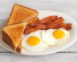 our Day Starts Here. The perfect combination of freshly prepared eggs, crispy bacon, or savory Hungarian sausage. Enjoy this high-quality American breakfast, served all day, with a beautiful sea view. Signature American Breakfast with eggs, bacon, or sausage at the beach resort near San Carlos City