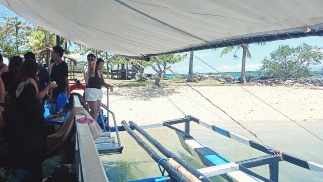 Your private paradise awaits. Our Party Boat parked safely on Tiningisan Island, ready for your group to enjoy the expansive beach. Party Boat parked on private island beach view