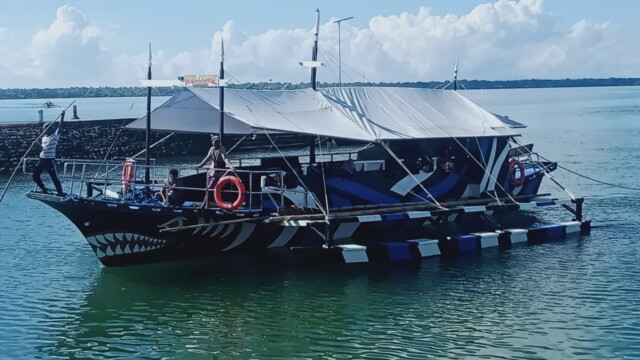 Your ride awaits! Our Party Boat is professionally prepared for your group's private island hopping adventure. Close up of Party Boat ready for passengers