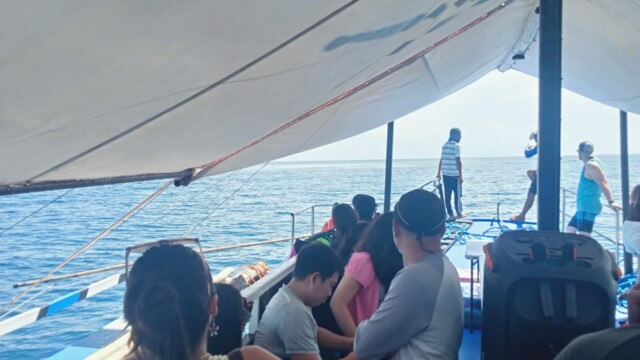 Plenty of room to socialize and celebrate! Enjoy the spacious deck of our Ultimate Party Boat. People socializing on Ultimate Party Boat deck rental