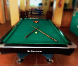 Evening Recreation. Relax with a game in our social hub. Billiard table and indoor recreation area at SmallFry’s Beach Resort.